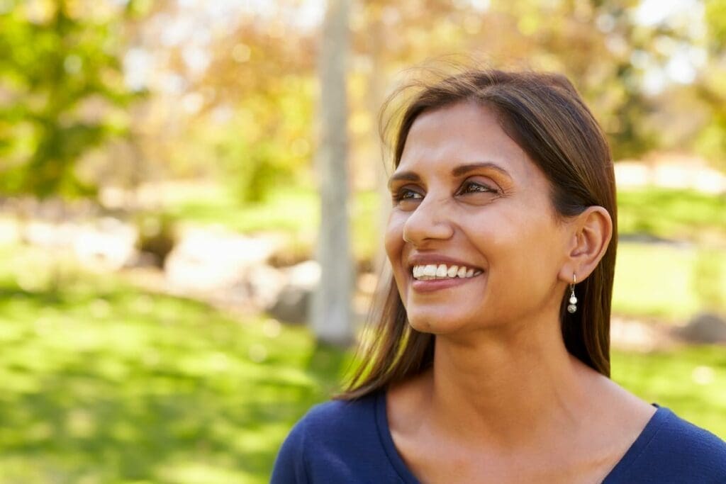 A woman getting vitamin D safely from the sun